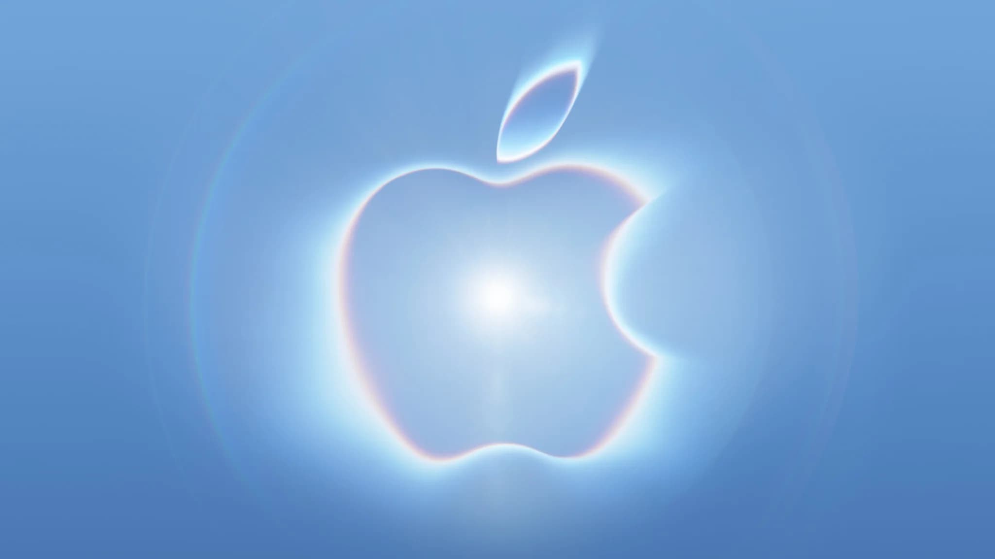 Glödande Apple-logotyp mot blå bakgrund