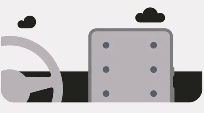 Googles illustration av Motion Assist med rörelsemarkörer längs kanterna på en mobilskärm i ett fordon.