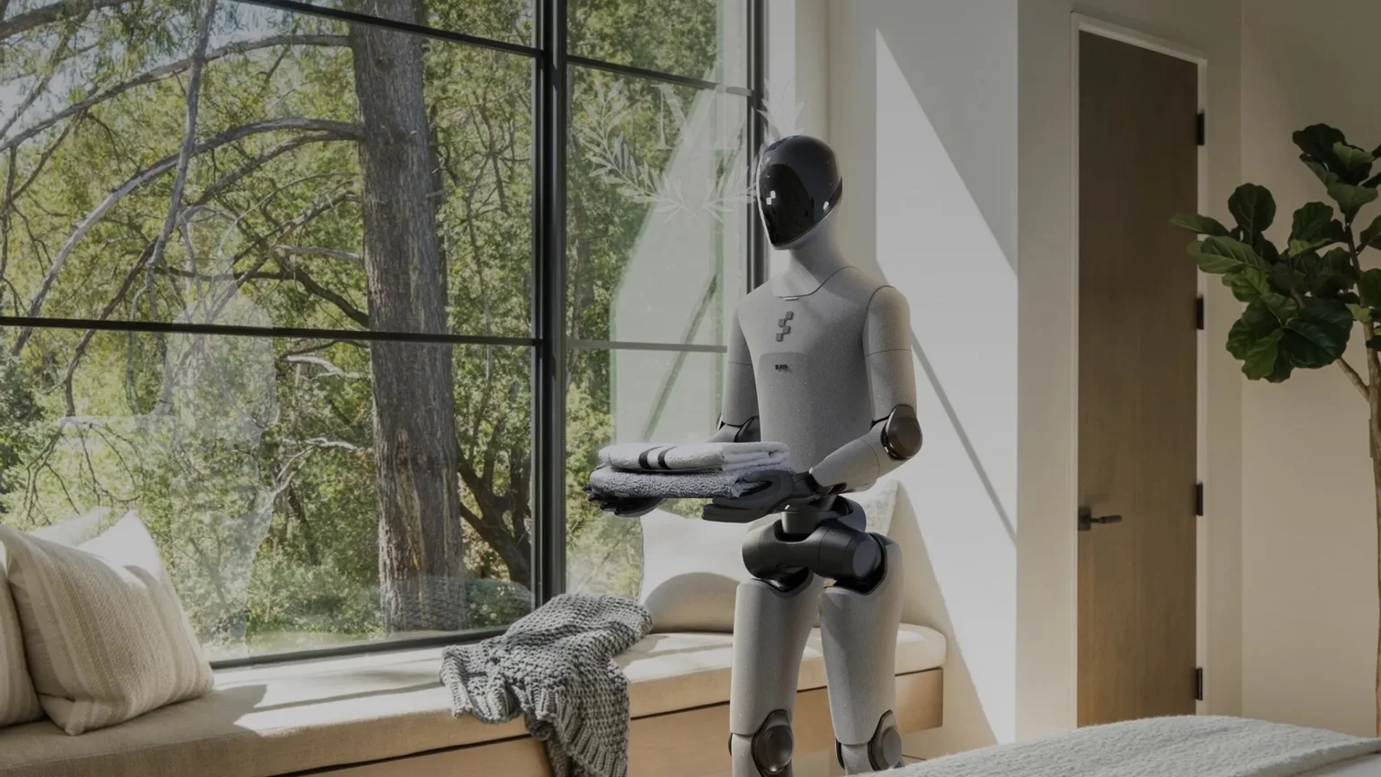 Figure 03, en humanoid robot från Figure, bär vikta handdukar i ett hem.