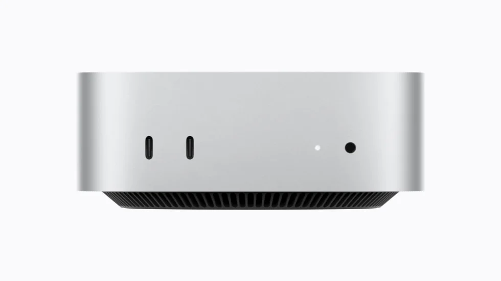 Framsidan av nya Mac mini med två USB-C-portar, statuslampa och hörlursuttag.
